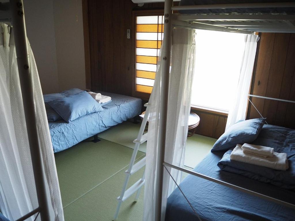 Guesthouse ＆ Beach Cafe Fuego Hyuga Rum bild